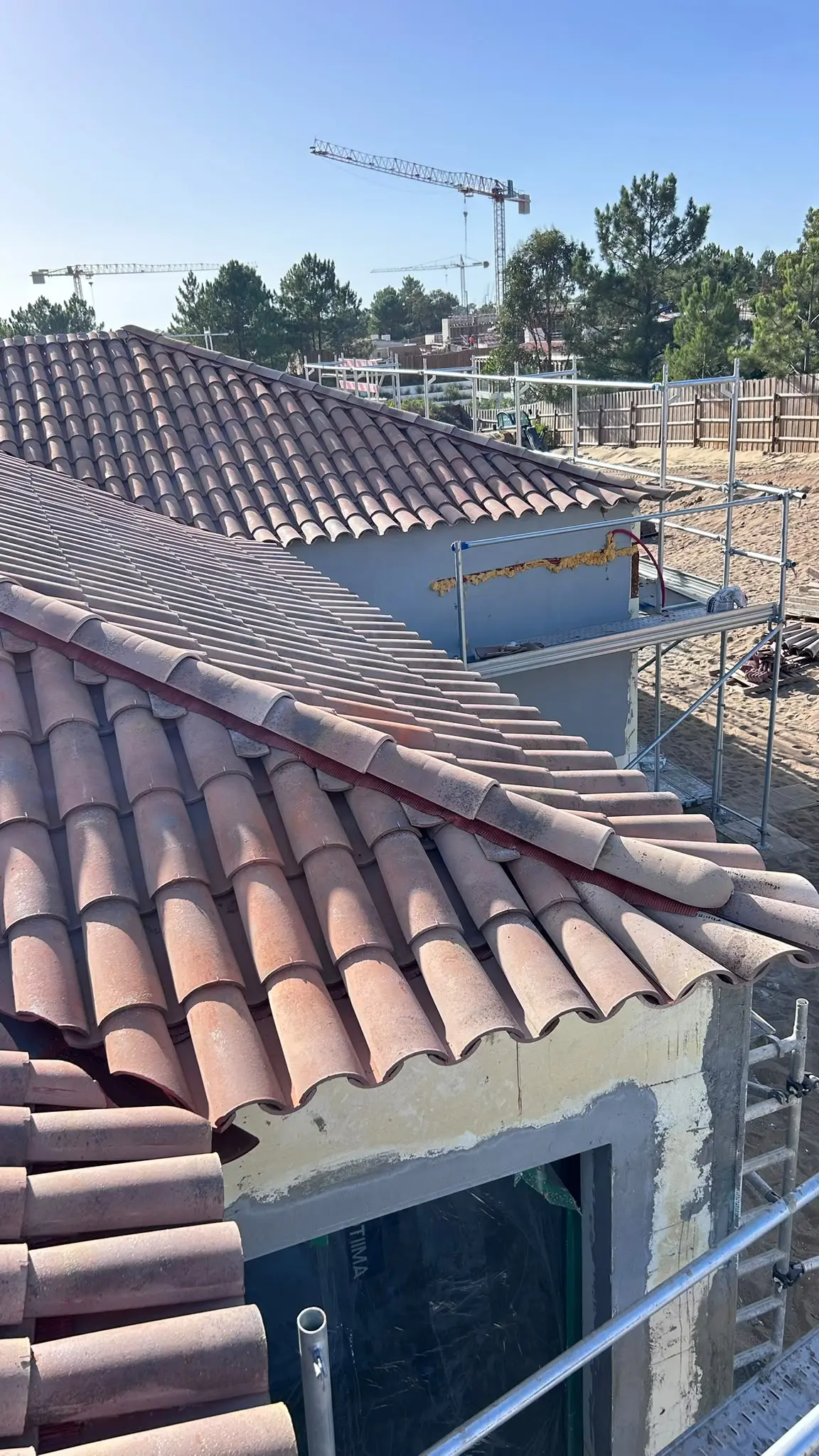 Clay-tile roof across several volumes